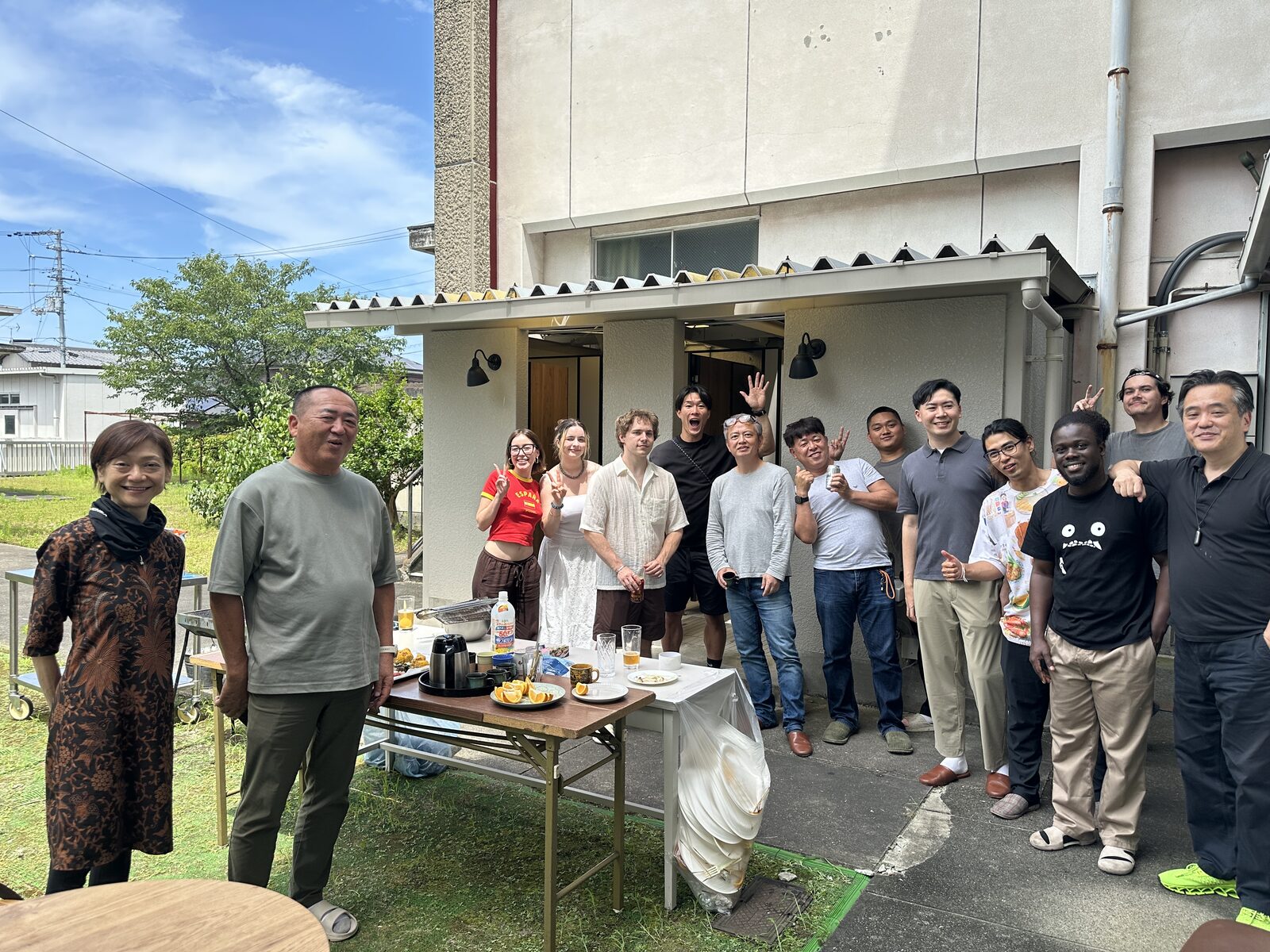 Participants and instructors gathered in front of the school building